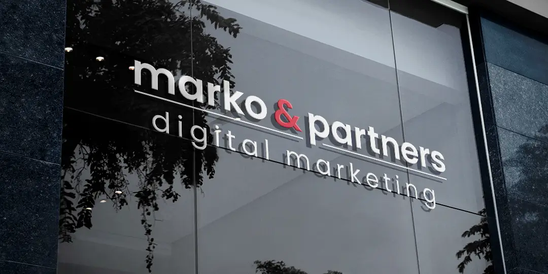 m&p-window-logo Marko & Partners logo on an office window
